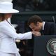 French President Emmanuel Macron kisses the hand of U.S. first lady Melania Trump during an arrival ceremony at the White House for Macron on April 24, 2018, in Washington, D.C.